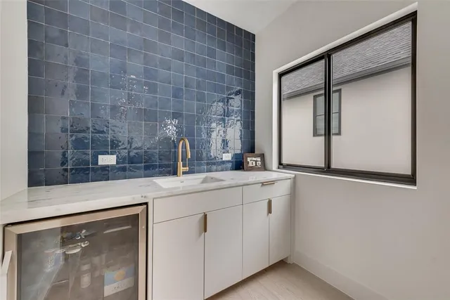 a bathroom with a sink and mirror