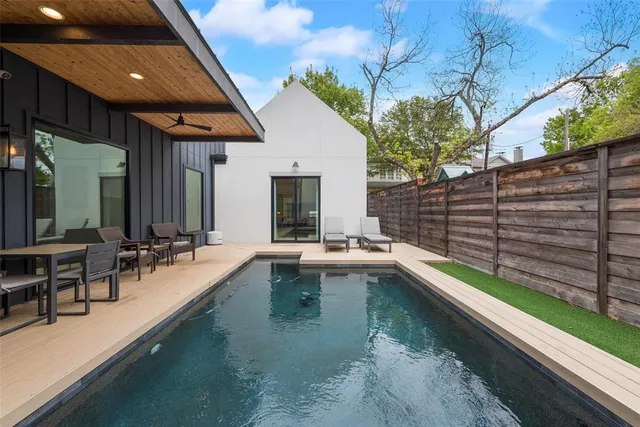 a view of swimming pool with outdoor seating