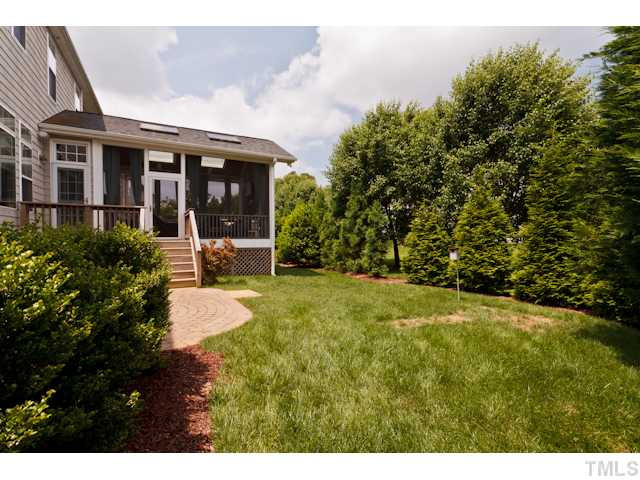 4004 Fenn Brook Lane Raleigh, NC 27613 - Photo 23 of 25 Beautiful back yard with luscious grass and beautiful privacy plantings. Exterior Back
