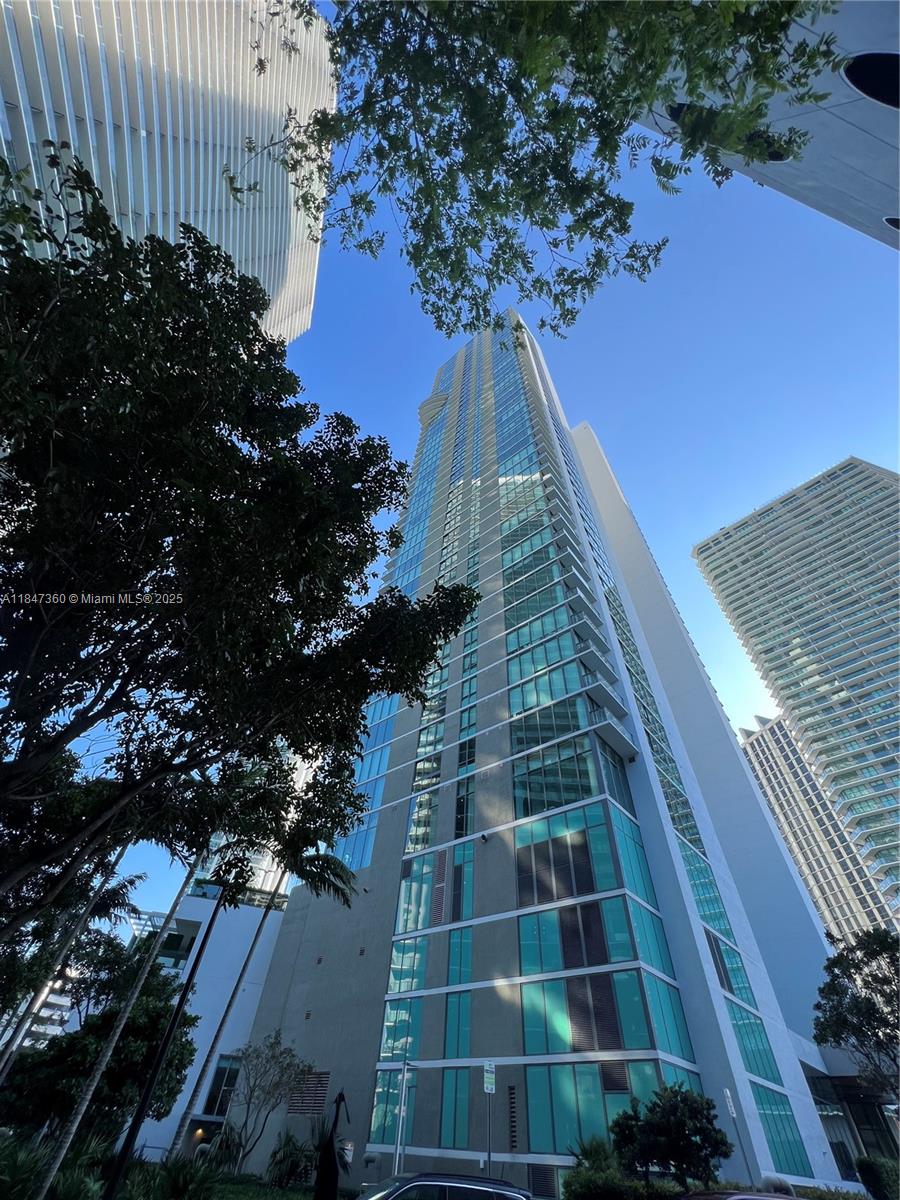 650 Northeast 32nd Street, Unit 3508 Miami, FL 33137 - Photo 3 of 13 a view of a yard with plants and wooden fence