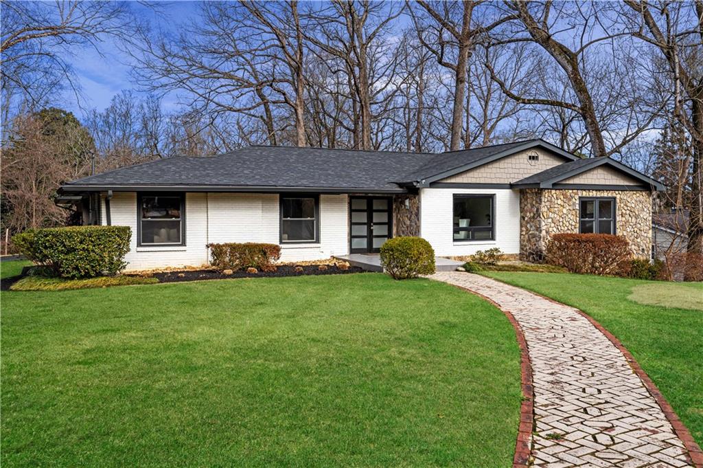 150 Robin Hood Road Northeast Atlanta, GA 30309 - Photo 1 of 1 a front view of house with yard and green space