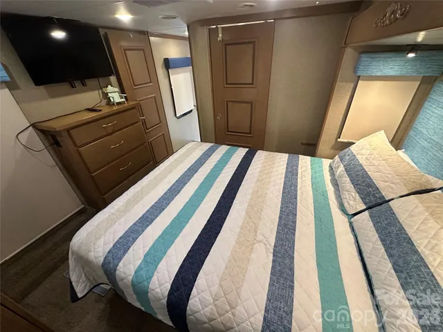 a bathroom with a toilet sink and a mirror