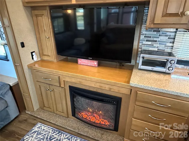 a stove top oven sitting inside of a kitchen