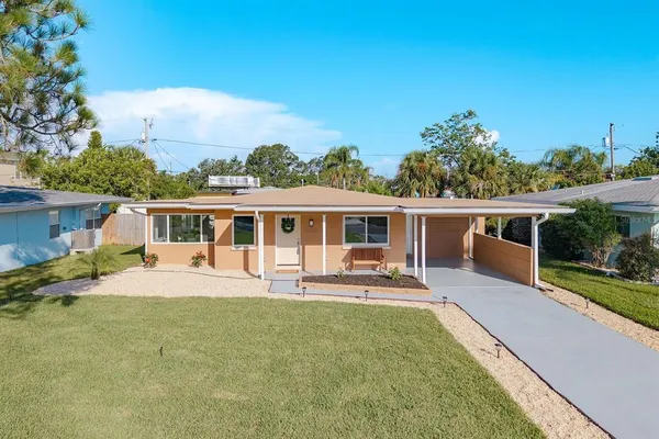 a front view of house with yard and seating area