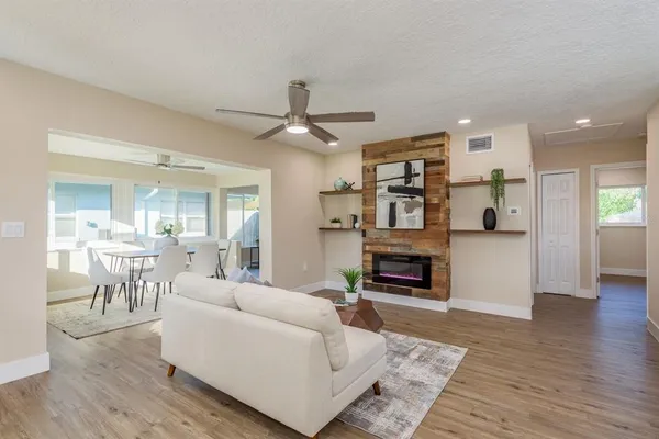 a view of a dining room with furniture window and wooden floor