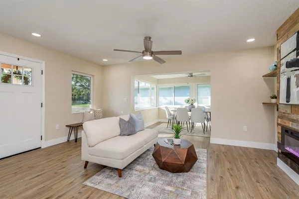 a living room with furniture and a large window