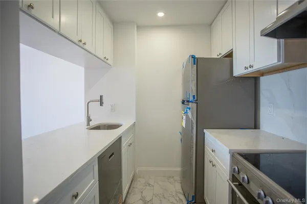 a view of kitchen with wooden floor