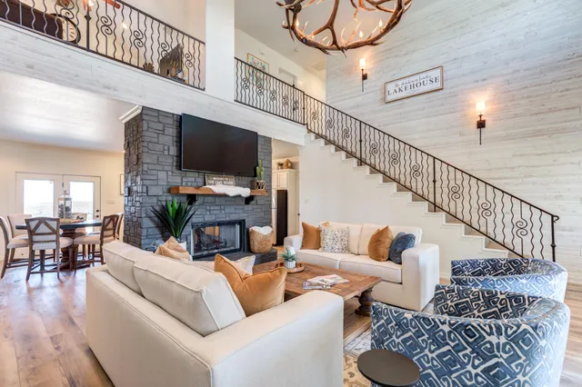 a living room with furniture a window and a clock