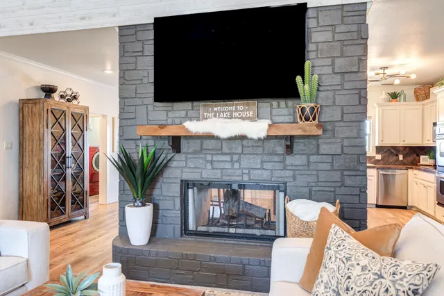a view of living room with furniture and wooden floor