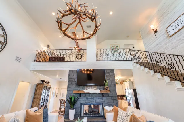 a kitchen with a sink stainless steel appliances and white cabinets