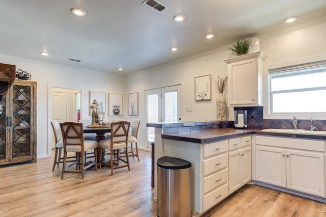 a kitchen with a sink and cabinets