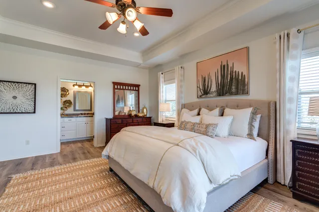 a living room with furniture a clock and a rug