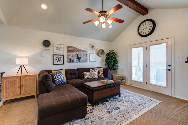 a living room with furniture and a rug