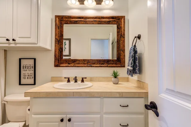 a front view of a house with sitting area