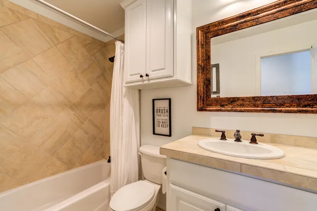 a view of a patio with couches and table and chairs