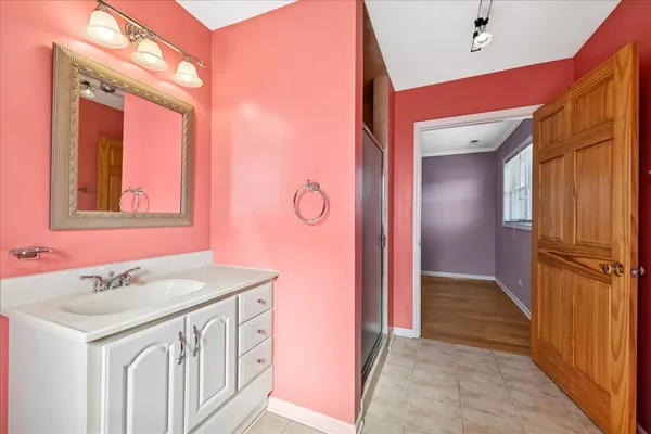 a bathroom with a sink a vanity and a mirror