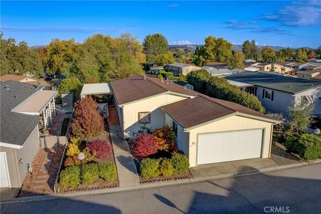 an aerial view of a house with a garden