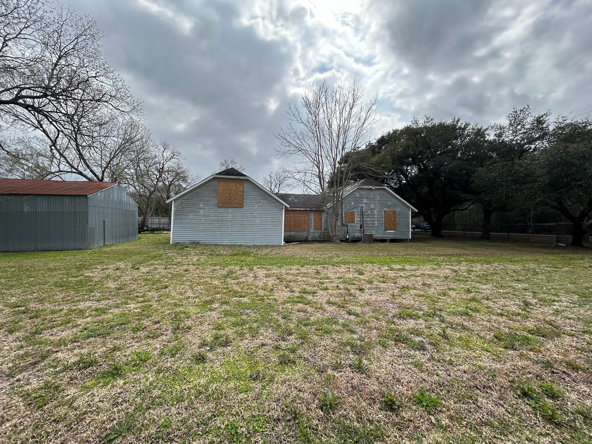 14201 Labrador Drive Houston, TX 77047 - Photo 11 of 11 a house with green field in front of it
