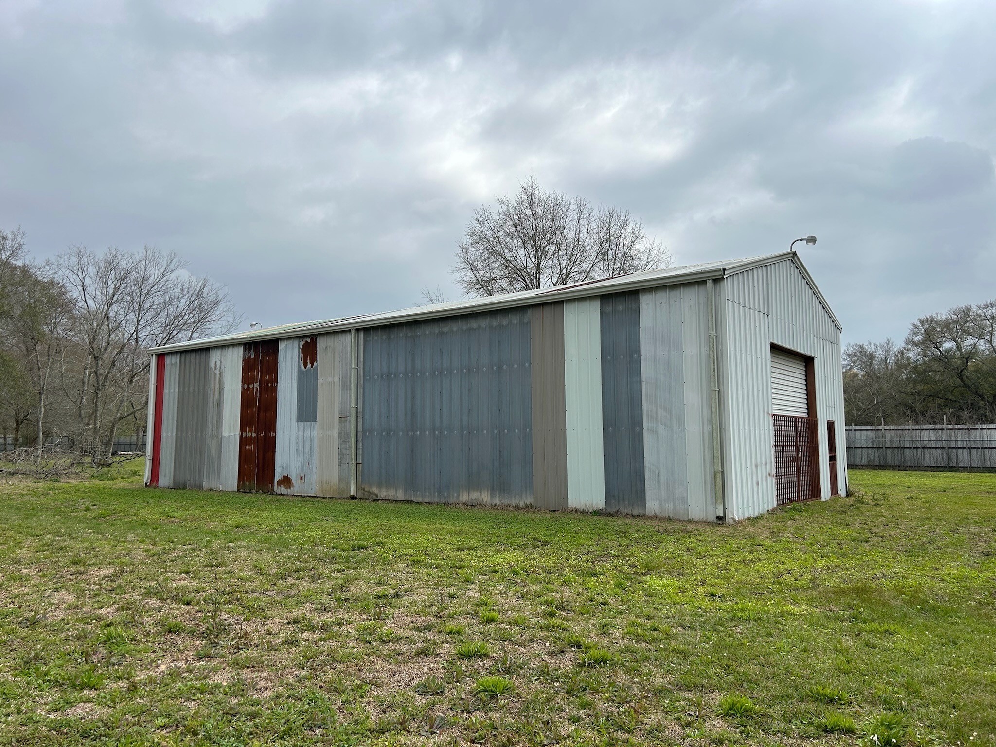 14201 Labrador Drive Houston, TX 77047 - Photo 10 of 11 a view of a backyard with potted plants and wooden fence