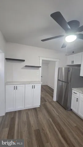 a view of a kitchen with a sink and dishwasher oven cabinets