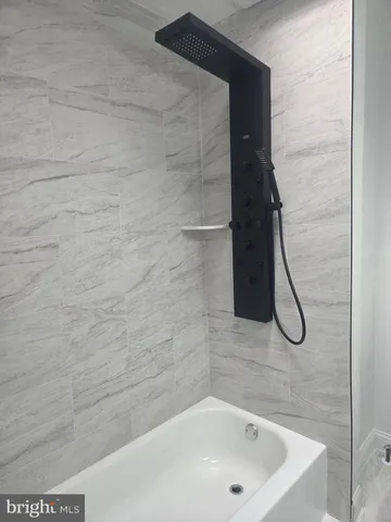 a bathroom with a bath tub