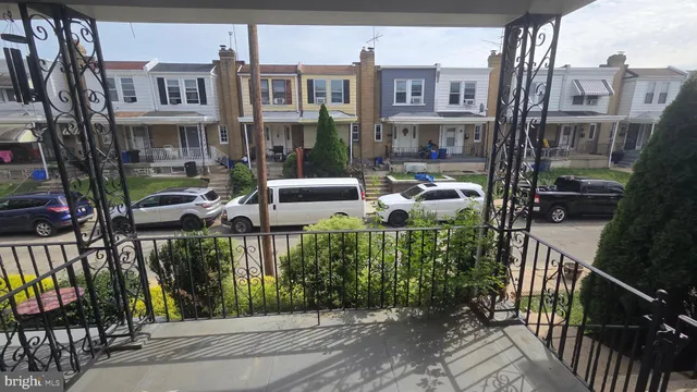 a view of street with sitting area