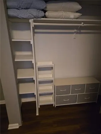 a view of an empty walk in closet