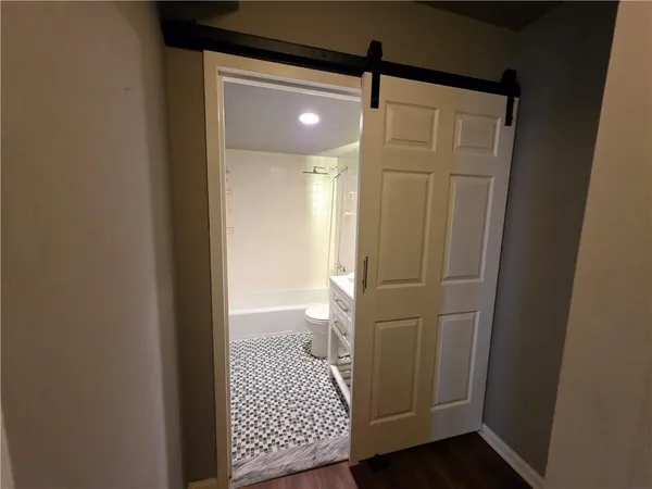 a bathroom with a shower and a toilet