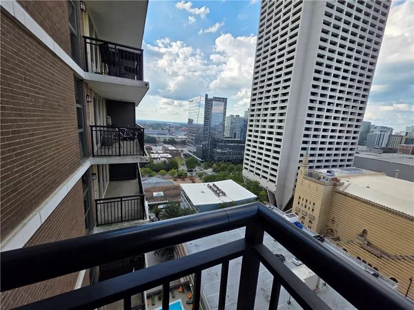 a view of a balcony with chairs