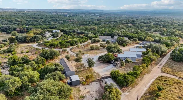 an aerial view of residential house with outdoor space