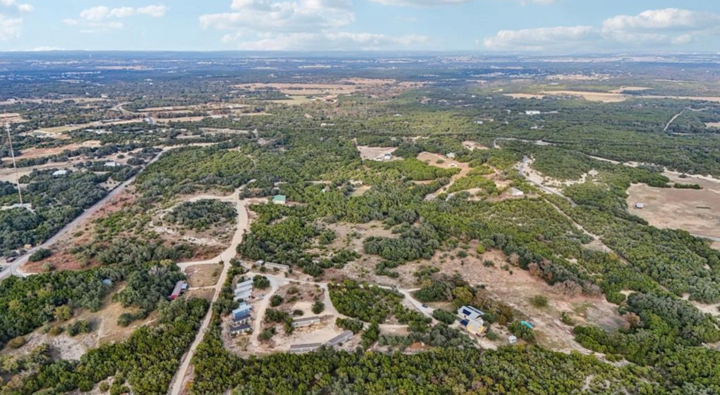 24369-2 Bingham Creek Road, Unit 1 Leander, TX 78641 - Photo 16 of 17 an aerial view of residential houses with outdoor space