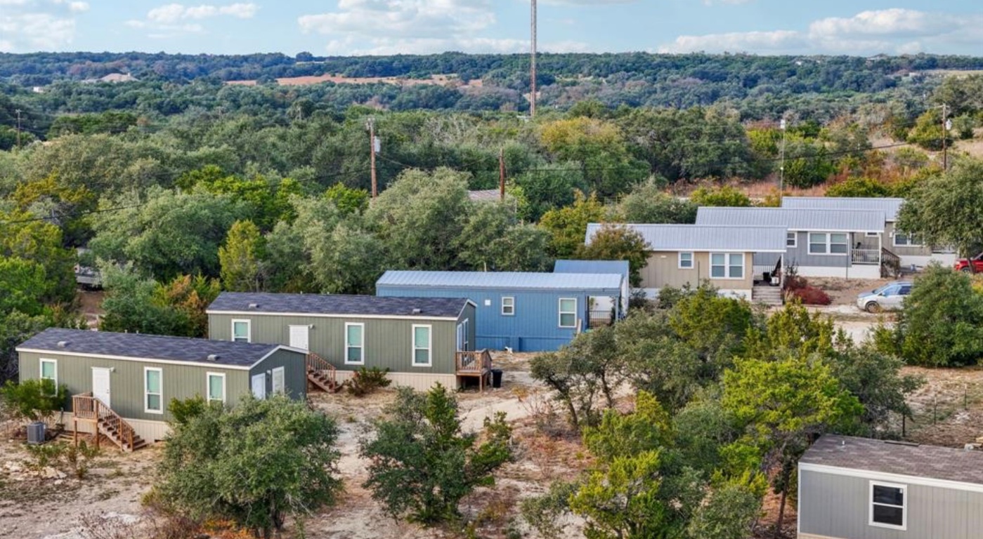 24369-2 Bingham Creek Road, Unit 1 Leander, TX 78641 - Photo 17 of 17 an aerial view of a house with a garden