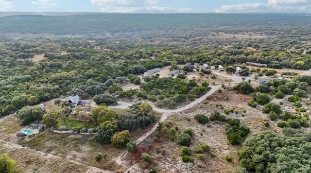 a view of a big yard with lots of green space