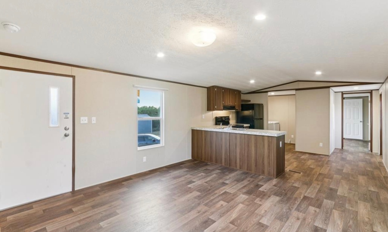 24369-2 Bingham Creek Road, Unit 1 Leander, TX 78641 - Photo 5 of 17 a view of a kitchen with a sink and cabinets