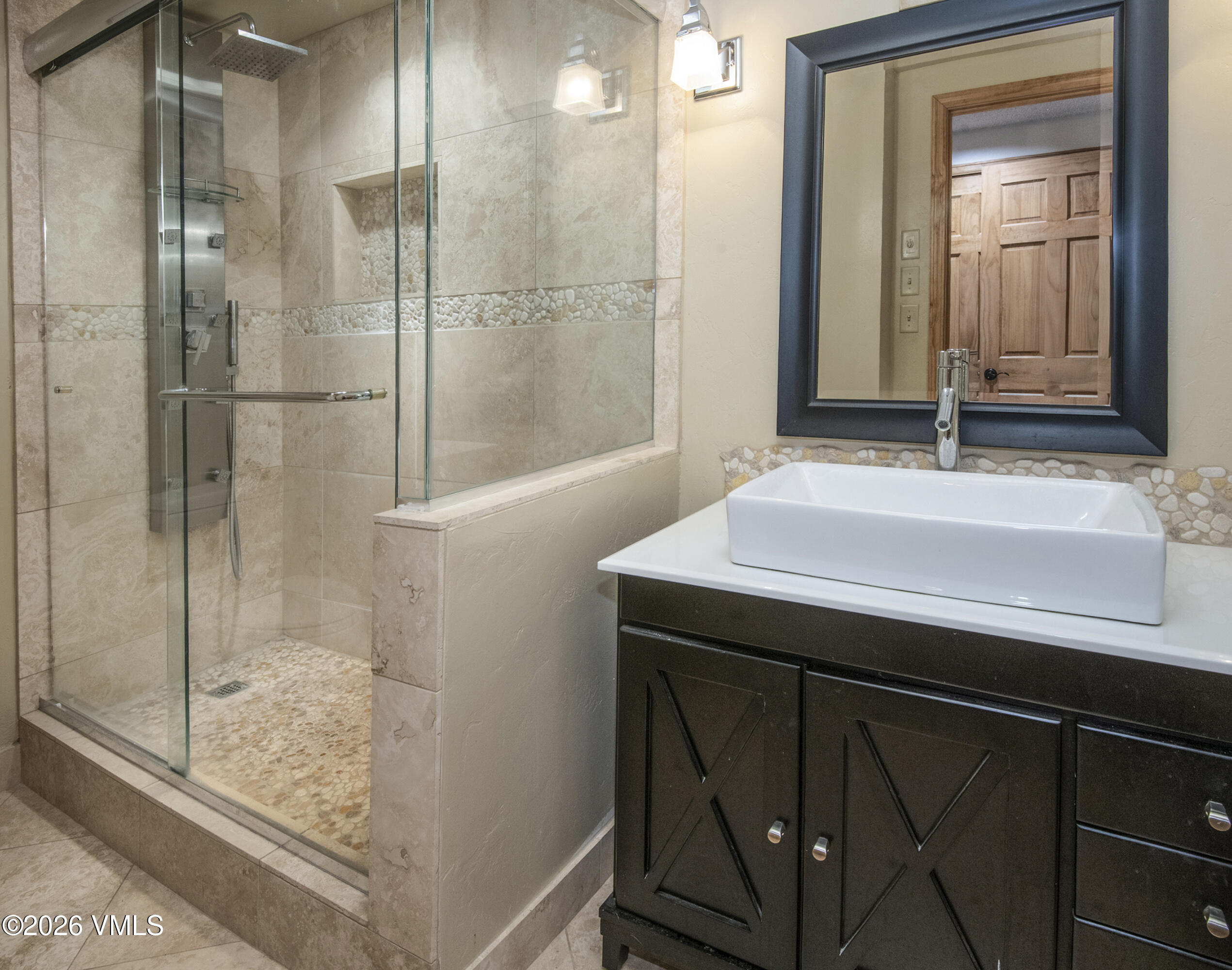 1650 Fall Ridge Road, Unit 202 Vail, CO 81657 - Photo 10 of 32 a bathroom with a sink and a mirror