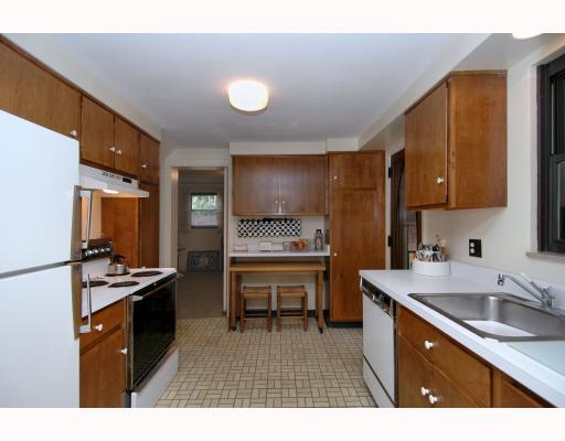 124 Virginia Road Pittsburgh, PA 15237 - Photo 6 of 17 Kitchen. SPACIOUS KITCHEN WITH WOOD CABINETS AND PLENTY OF COUNTER SPACE AND A BUILT IN TABLE FOR KITCHEN DINING