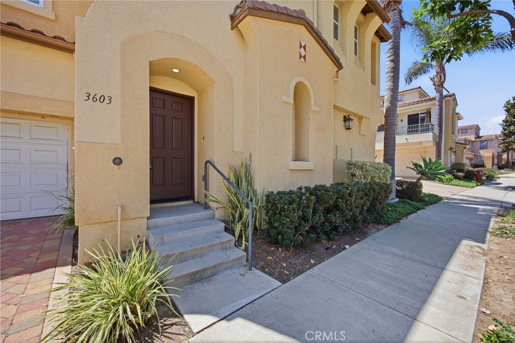 3603 Jetty Carlsbad, CA 92010 - Photo 5 of 43 a front view of a house with a yard