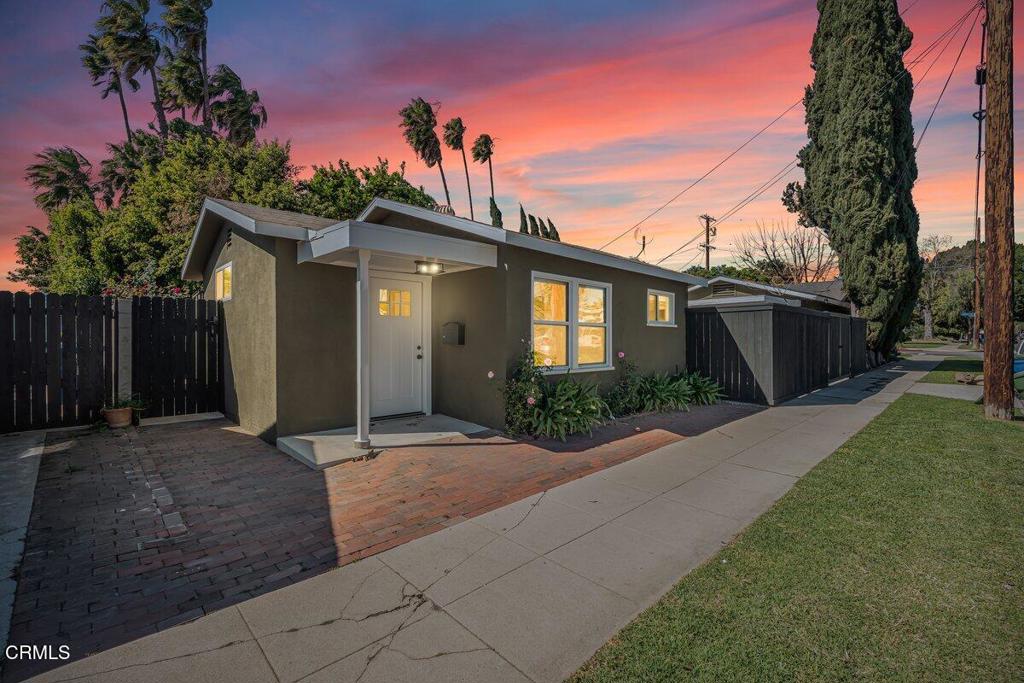 6131 Ranchito Avenue Los Angeles, CA 91401 - Photo 1 of 12 a front view of a house with a yard and garage