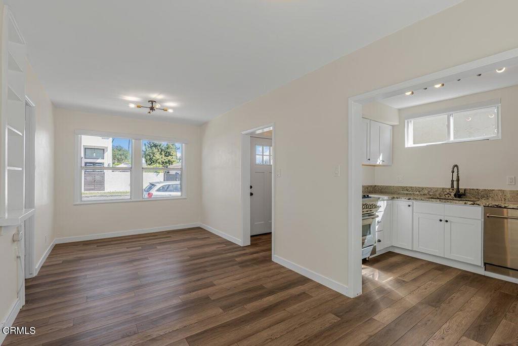 6131 Ranchito Avenue Los Angeles, CA 91401 - Photo 5 of 12 a view of an empty room with window and wooden floor