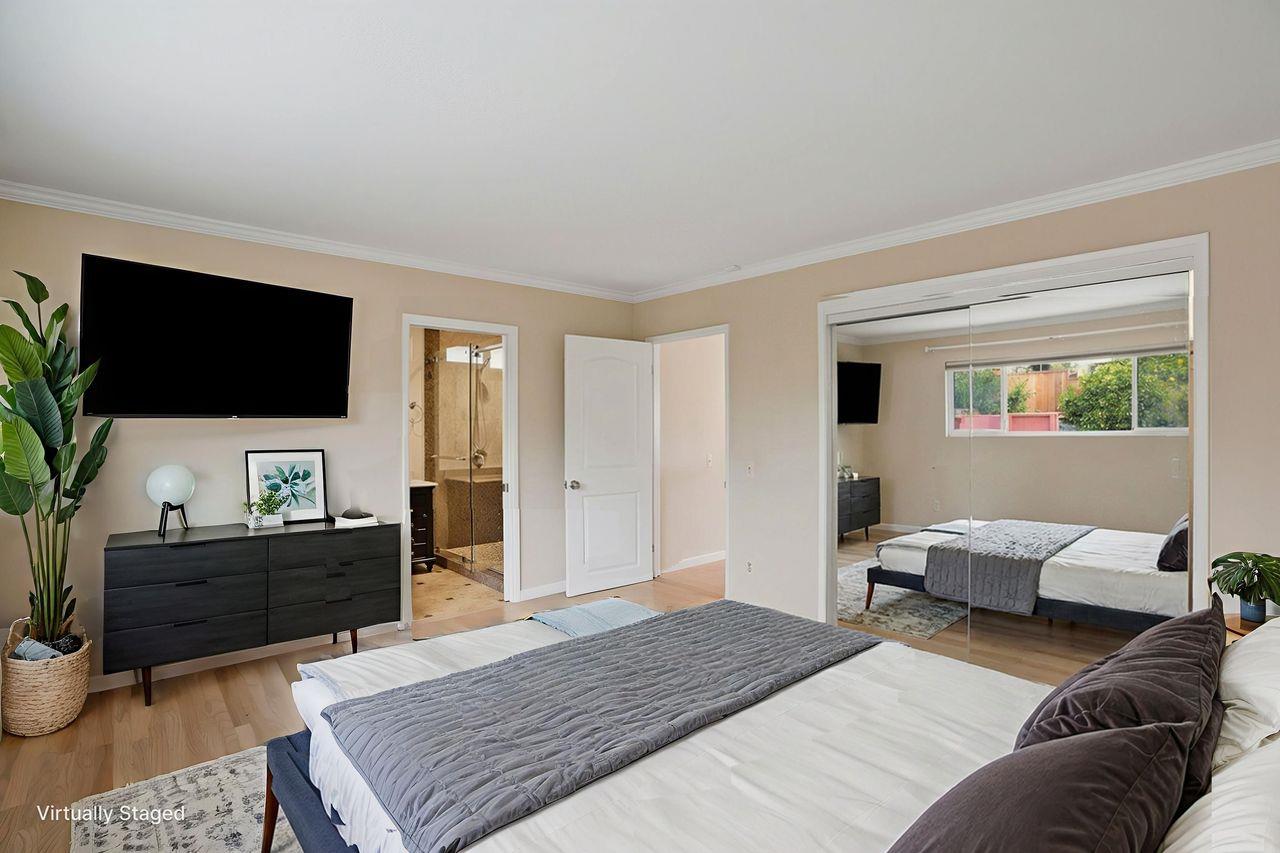 701 Archer Street Monterey, CA 93940 - Photo 15 of 39 a bedroom with a bed and a flat screen television