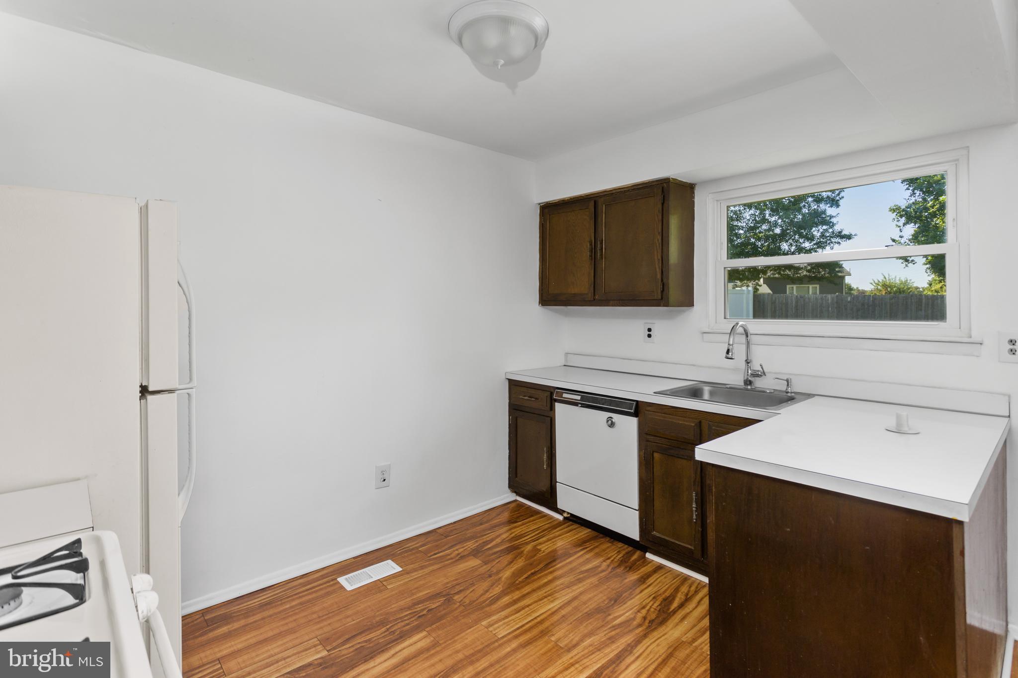 12 Kingsley Road Mount Holly, NJ 08060 - Photo 13 of 32 a kitchen with stainless steel appliances granite countertop a sink stove and microwave