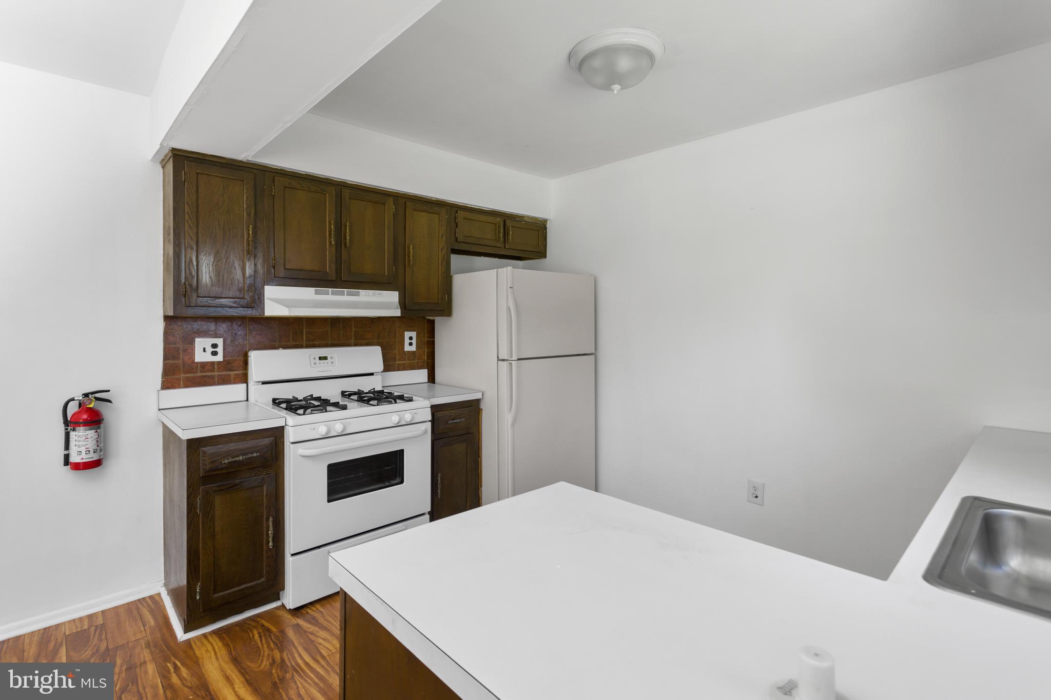 12 Kingsley Road Mount Holly, NJ 08060 - Photo 14 of 32 a kitchen with a refrigerator sink and stove