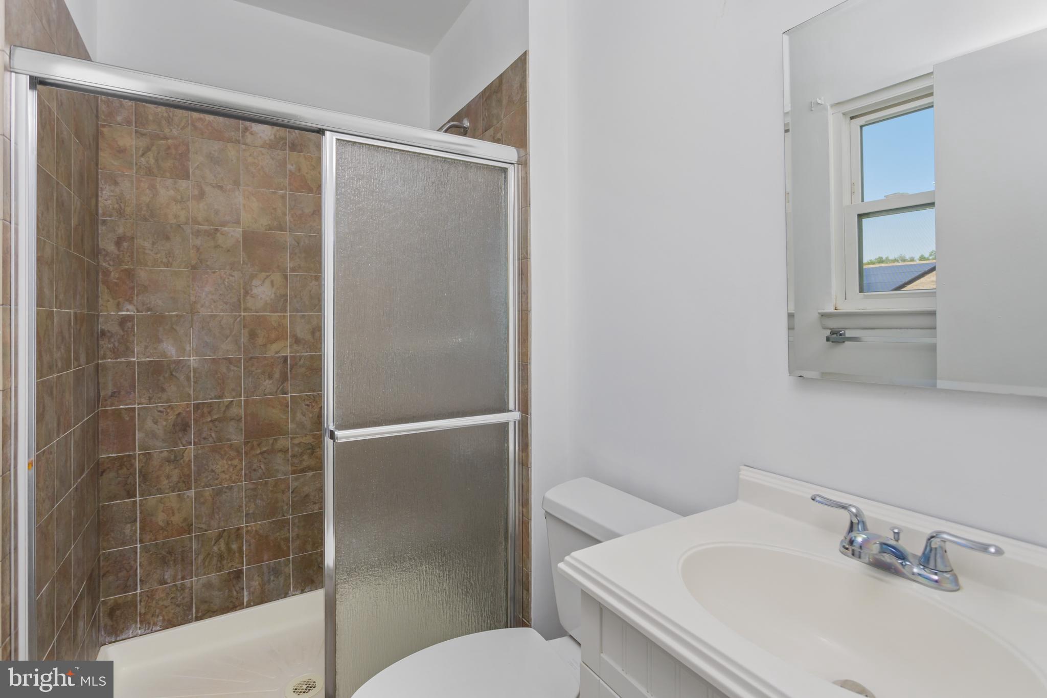 12 Kingsley Road Mount Holly, NJ 08060 - Photo 18 of 32 a bathroom with a sink toilet and shower