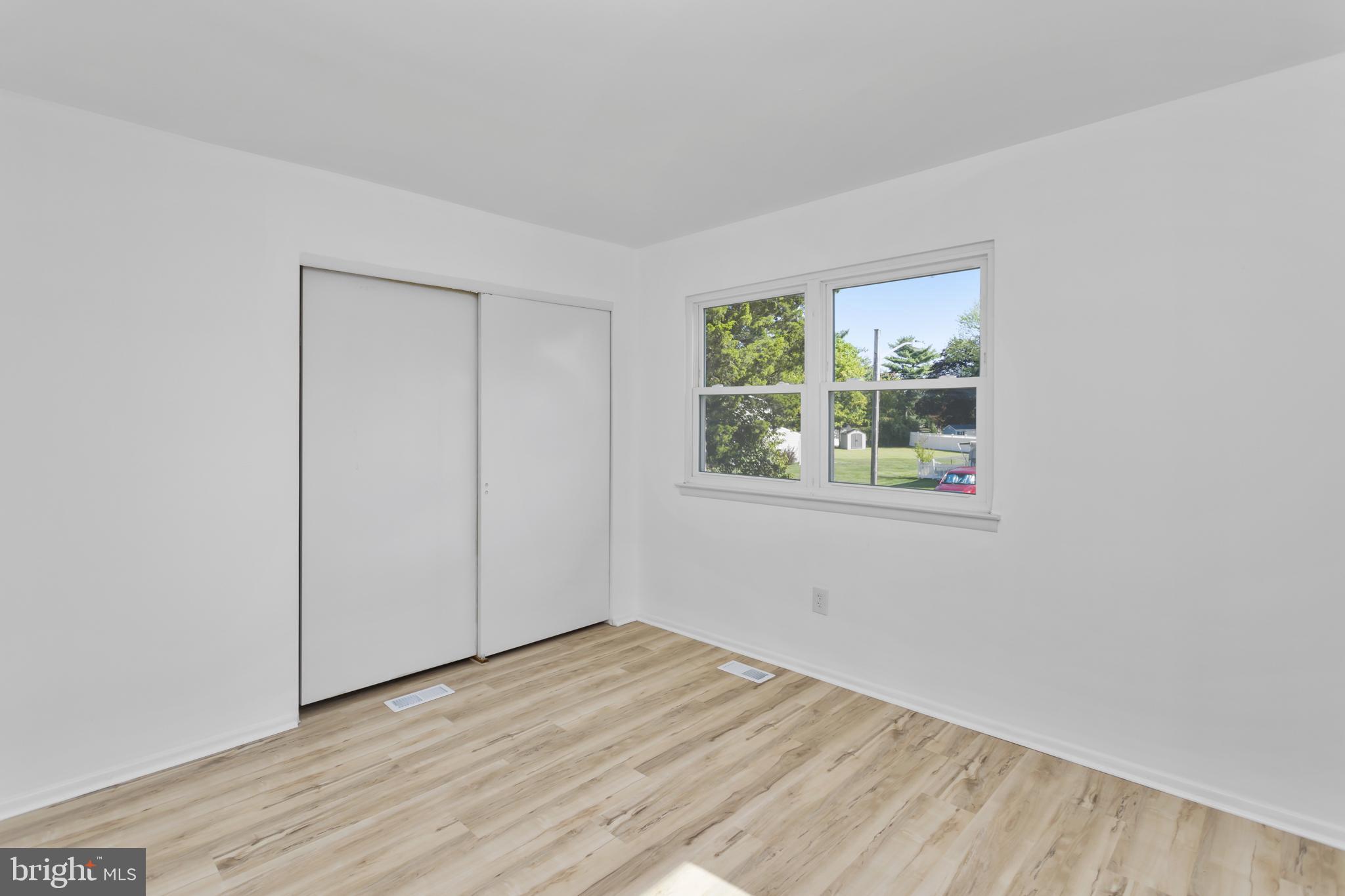 12 Kingsley Road Mount Holly, NJ 08060 - Photo 21 of 32 an empty room with wooden floor and windows