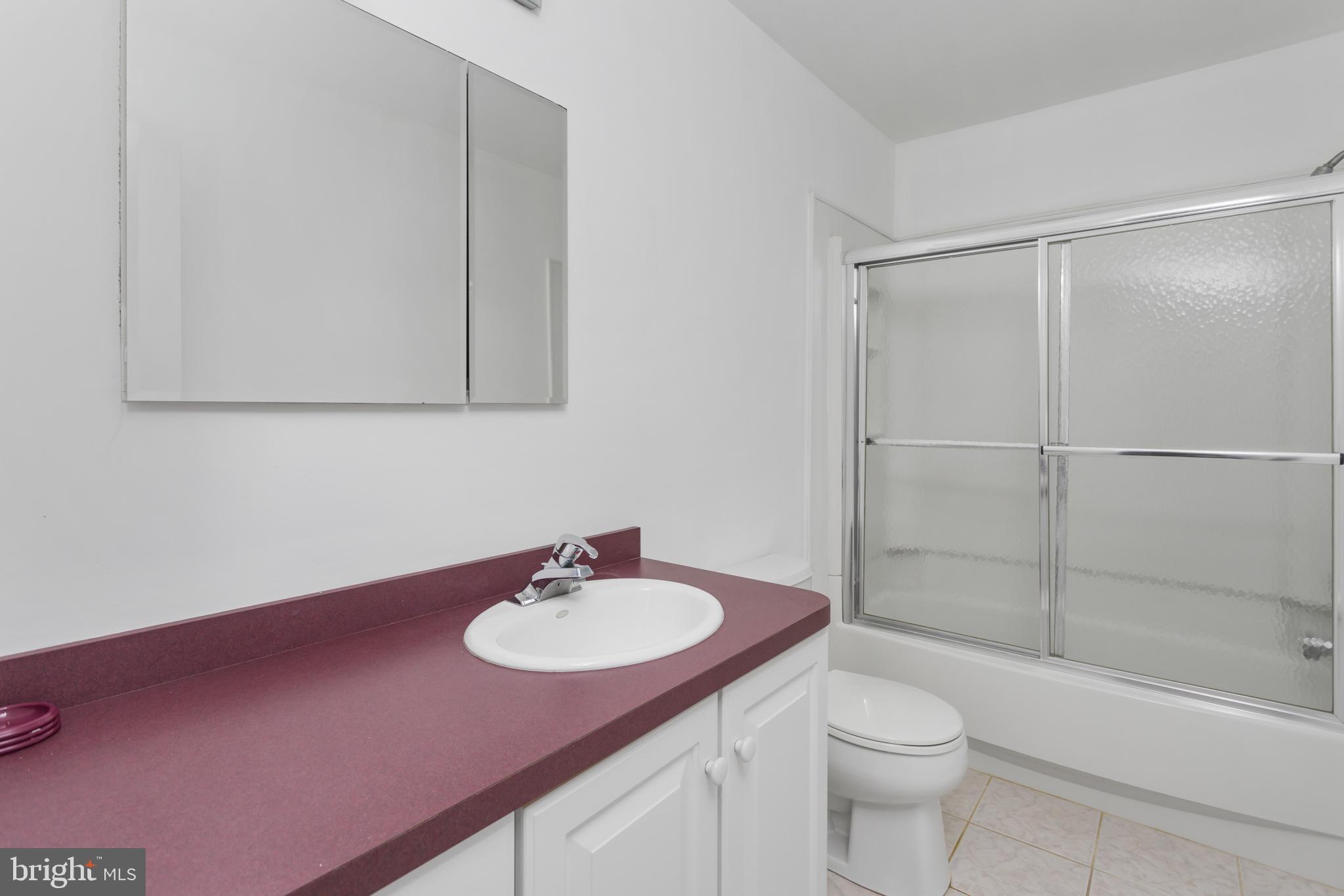 12 Kingsley Road Mount Holly, NJ 08060 - Photo 23 of 32 a bathroom with a sink toilet a mirror and shower