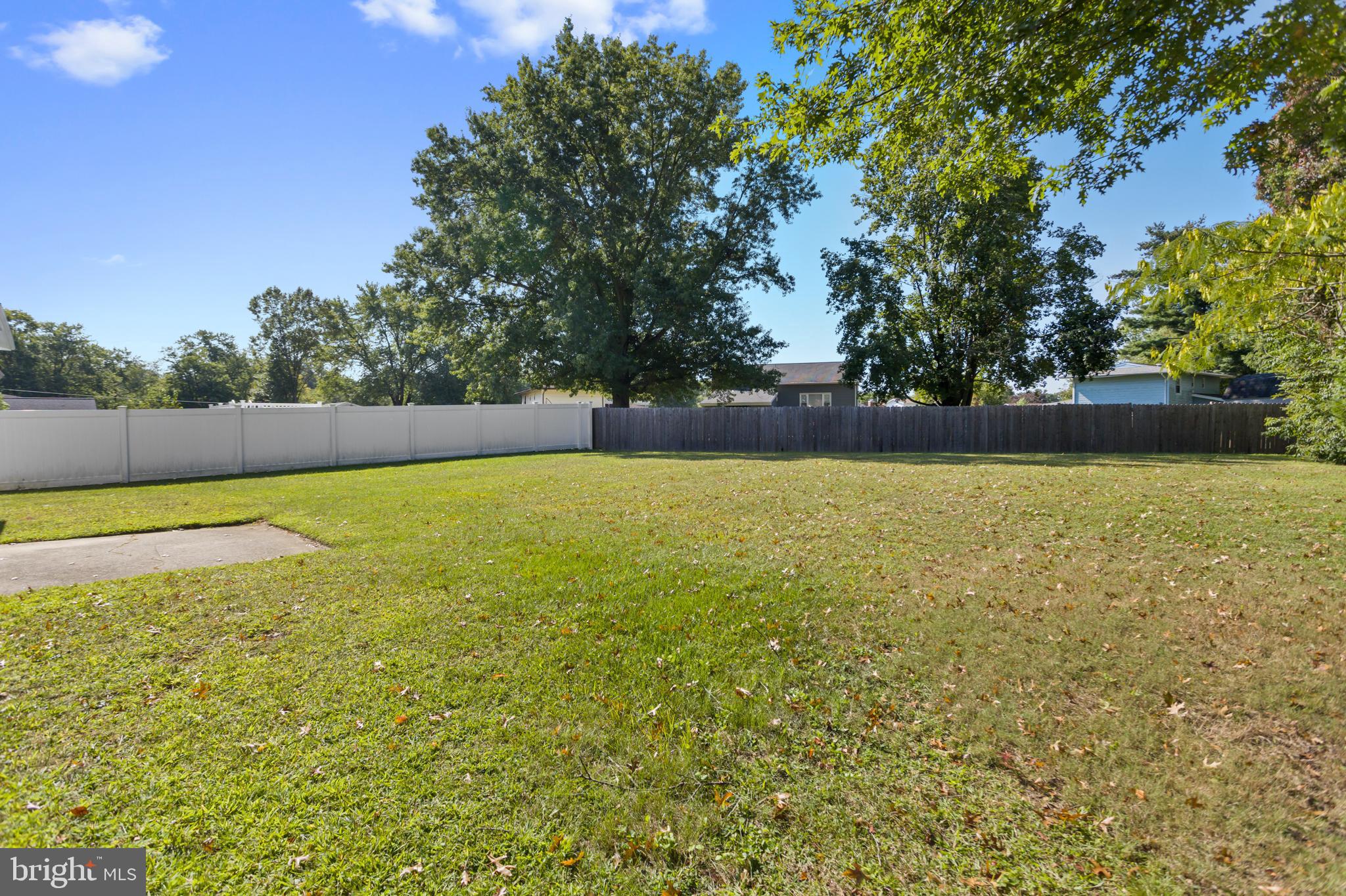 12 Kingsley Road Mount Holly, NJ 08060 - Photo 32 of 32 a view of a swimming pool and trees in the background