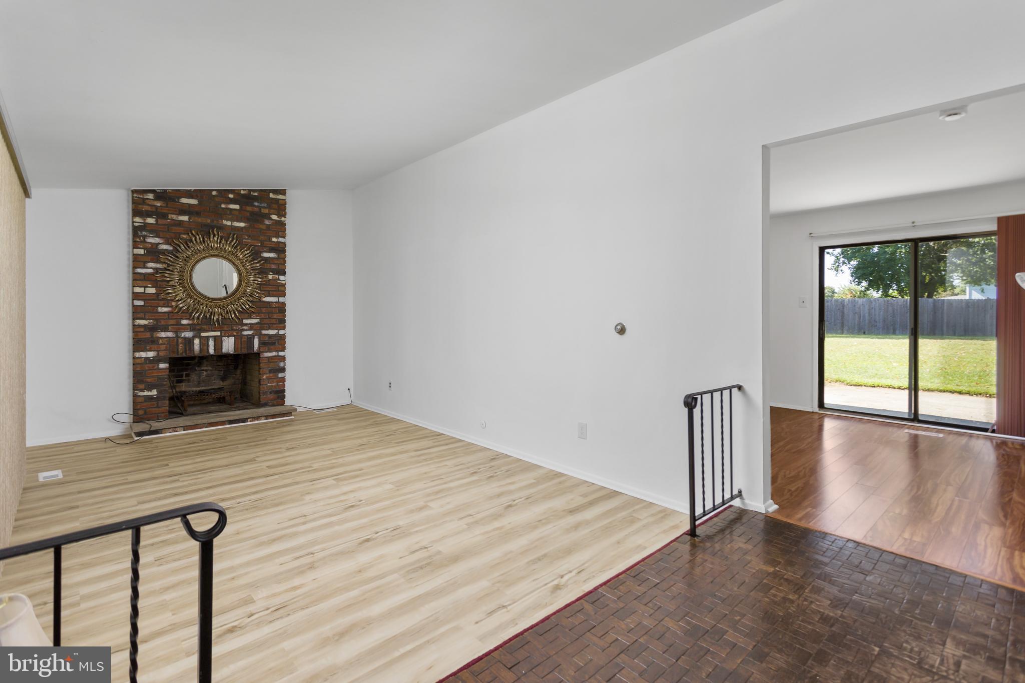 12 Kingsley Road Mount Holly, NJ 08060 - Photo 8 of 32 wooden floor in an empty room with a window