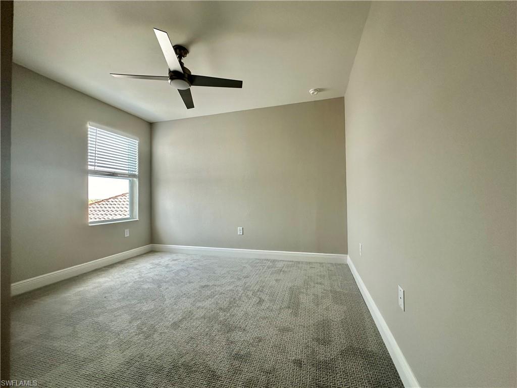 4580 Centaurus Circle Naples, FL 34120 - Photo 12 of 25 Unfurnished room featuring light colored carpet and ceiling fan