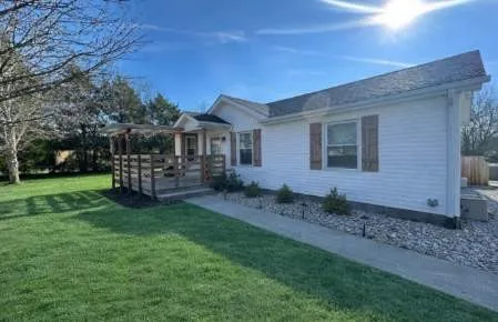 a front view of a house with garden