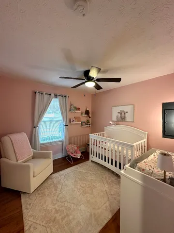 a bedroom with furniture and a window